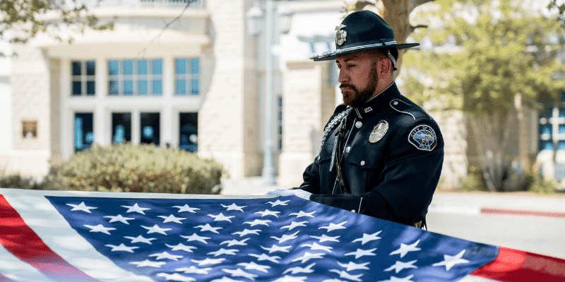 The Hemet Police Honor Guard fold the American flag